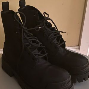 Black Balenciaga strike boots